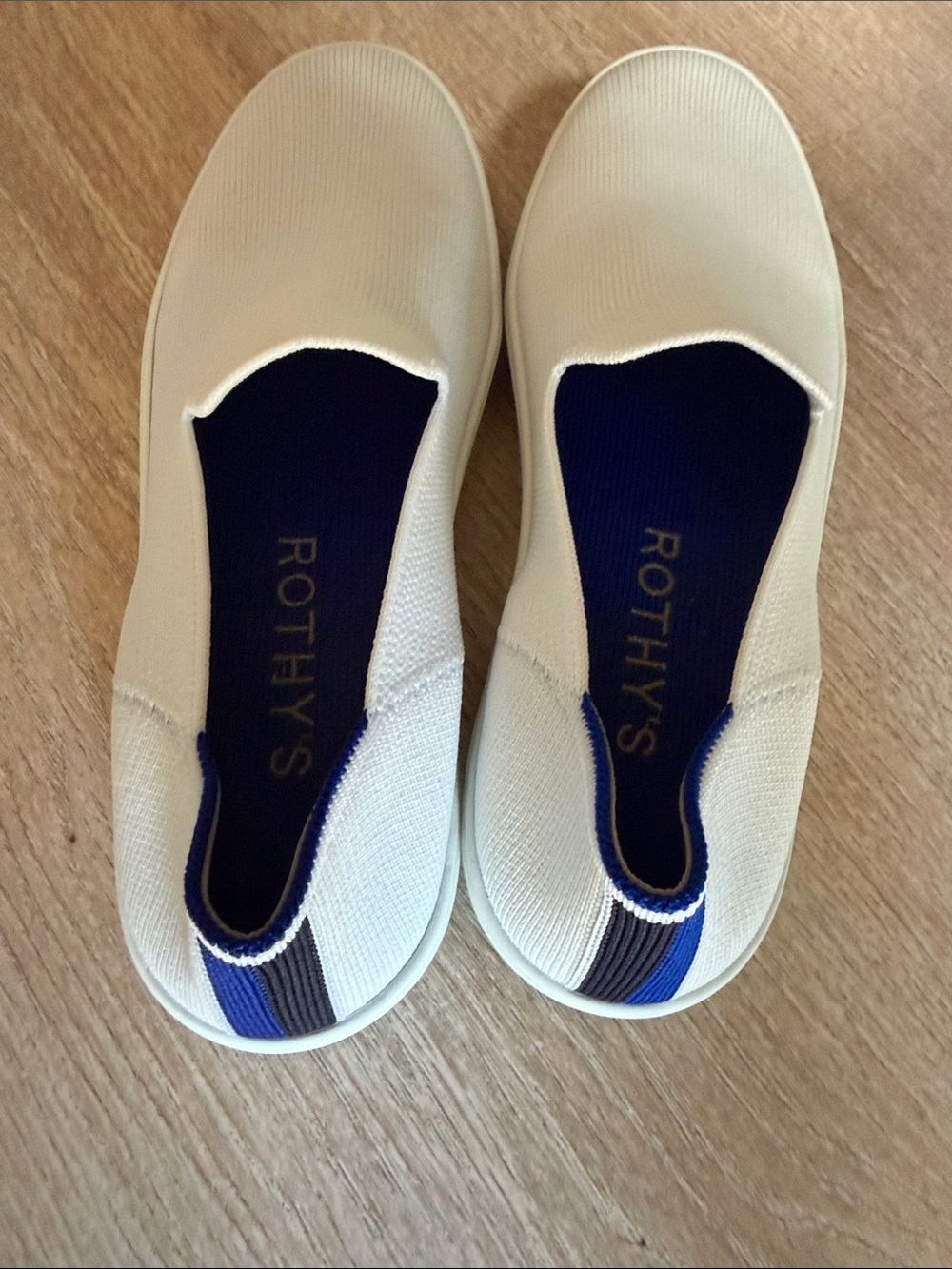 Rothy's White Slip-On Sneakers with Navy Heel Trim - Picture 2 of 5